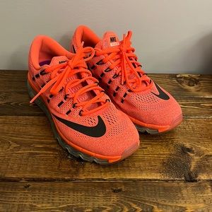 Gently worn orange Nike running shoes